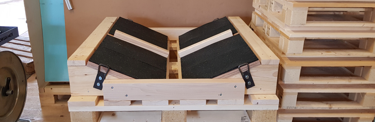 Massgeschneiderte Verpackung von Kabelrollen für den sicheren Transport.